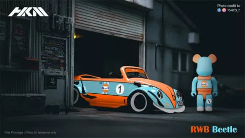 Orange and white Gulf RWB Beetle diecast model car with blue figure