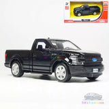 Black pickup truck diecast model car with silver wheels, front view