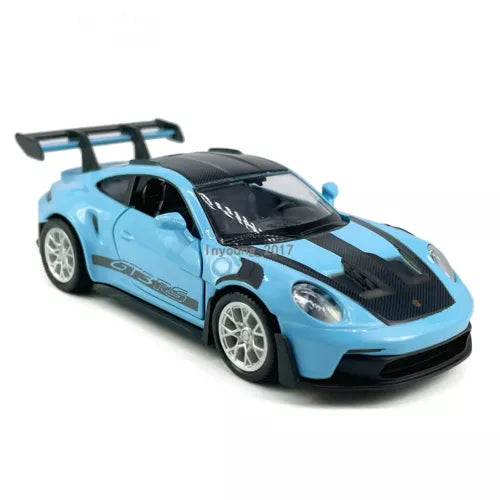Light blue diecast model car with black hood, front headlights and silver wheels