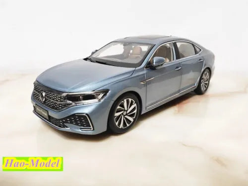 1:18 diecast sedan model, metallic gray, front three-quarter view with alloy wheels