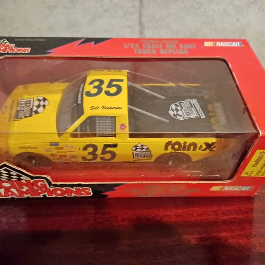 1:24 NASCAR diecast race car with #35 yellow body in blister box packaging