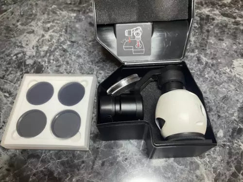 Camera gimbal and lens unit in open case with four circular lens caps