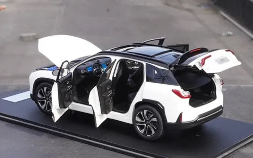 White and black diecast SUV model with open doors, rear spoiler and wheels