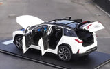 White and black diecast SUV model with open doors, rear spoiler and wheels