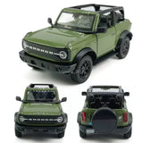 Green Ford Bronco diecast model car with black roof and grille, front 3/4 view
