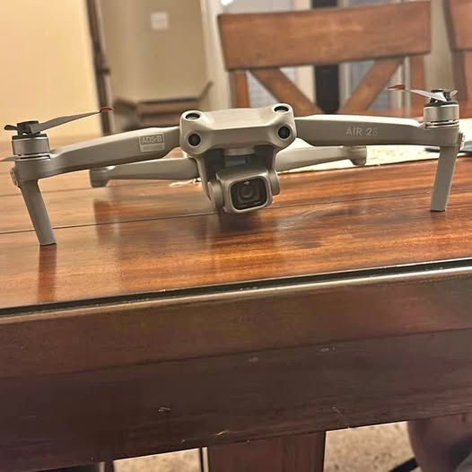 DJI Air 2S drone with four propellers, front camera housing, light gray body