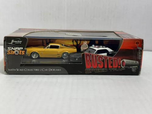 Yellow 1:64 diecast car toy in retail box with window and BUSTED Speed Trap graphic