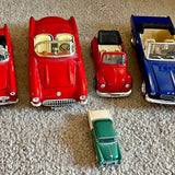 Diecast model car set with red, green, and blue cars