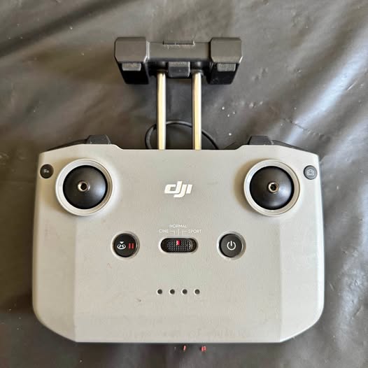 DJI drone remote controller with dual joysticks and button controls