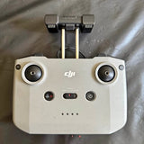 DJI drone remote controller with dual joysticks and button controls