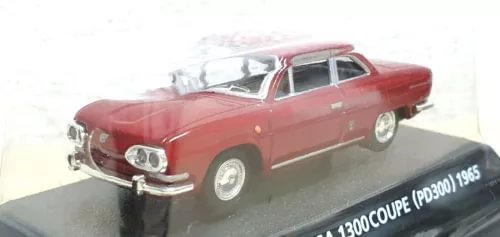 Red diecast coupe car model with chrome grille and headlights on display base