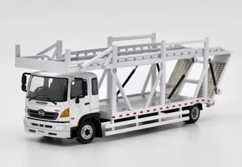 White diecast truck model with double transport platform and loading rails, 1:64 scale