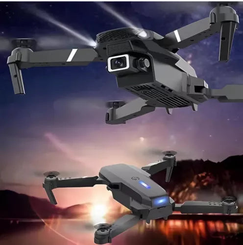 Foldable gray quadcopter drone with front camera and obstacle sensor lights