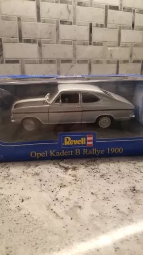 1:18 scale Opel Kadett Rallye diecast car in blue-and-gray display box