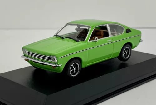 Green 1:43 diecast coupe car model with chrome grille and black wheels