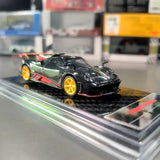 Pagani Imola Nero Oro 1/64 diecast race car, black with gold accents, on display base