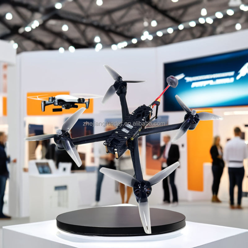 Carbon fiber UAV drone with four propellers, mounted on display stand.