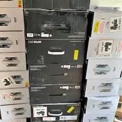 Stack of black drone quadcopter shipping boxes with labels