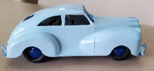 Light blue diecast toy car with black wheels, front side view