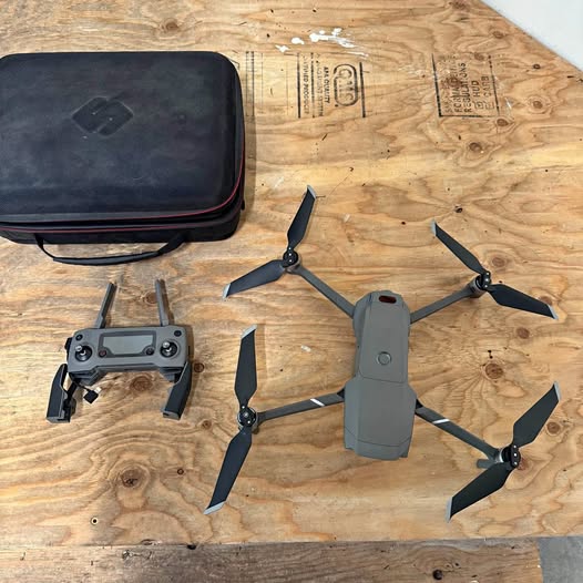 DJI Mavic 2 Zoom drone with four foldable propellers and remote, plus carrying case