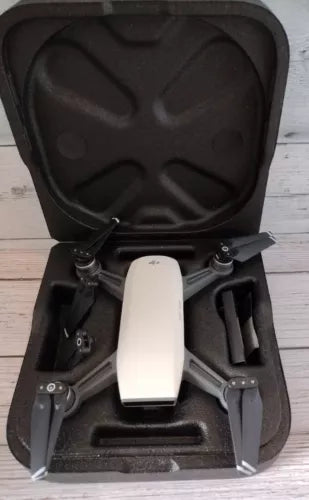 DJI Spark 1080p drone with white body, propellers folded, in open black case