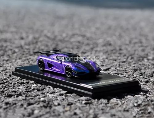 Purple diecast sports car model on black display base