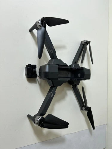 Gray quadcopter drone with foldable arms and camera gimbal, 4 rotors