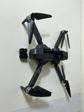 Gray quadcopter drone with foldable arms and camera gimbal, 4 rotors