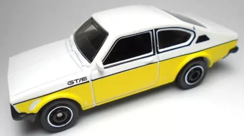 Yellow and white coupe diecast car, black wheels, GT/E badge