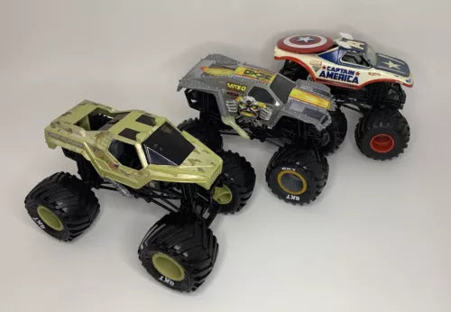 Camo green and black diecast monster truck with oversized wheels and Captain America emblem