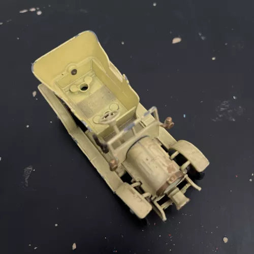Yellow diecast car model, open engine area and wheels