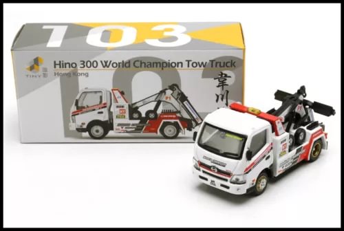 Diecast tow truck model with white cab, red and black details, and crane arm
