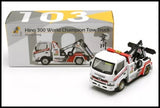 Diecast tow truck model with white cab, red and black details, and crane arm