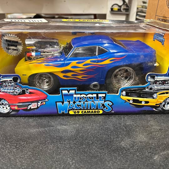 1:18 scale 1969 Camaro diecast car with blue and yellow flames