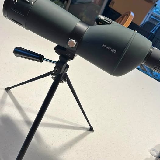 Dark gray monocular telescope with 20–60x60 eyepiece on tripod stand