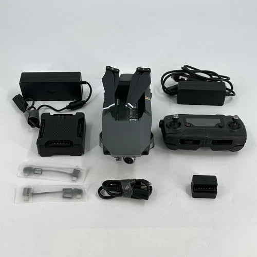 DJI Mavic Pro drone with controller, chargers, and cables