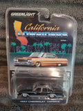 Black 1987 Chevrolet Caprice diecast toy car in clear blister package