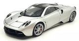 Silver diecast sports car model with black hood and side vents