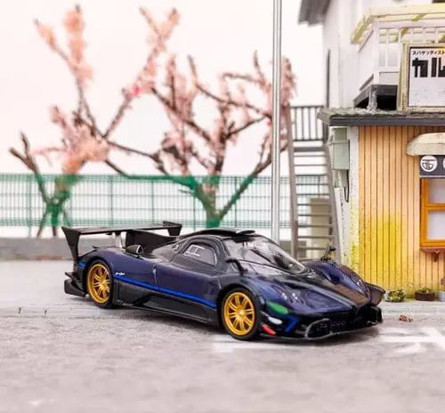 Blue and black 1:64 sports diecast model car with rear spoiler and gold wheels