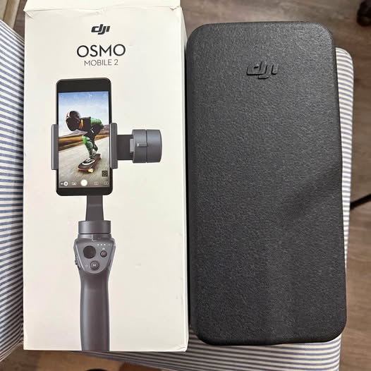 DJI Osmo Mobile 2 smartphone gimbal with textured carrying case and control handle