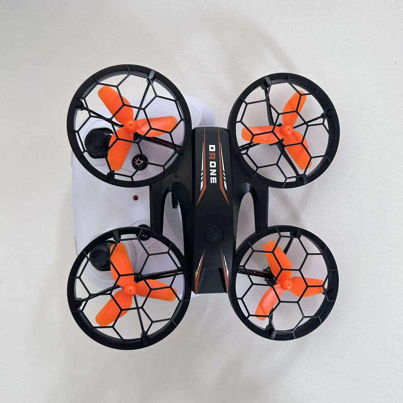 Mini quadcopter drone with four soccer-style prop guards and orange blades