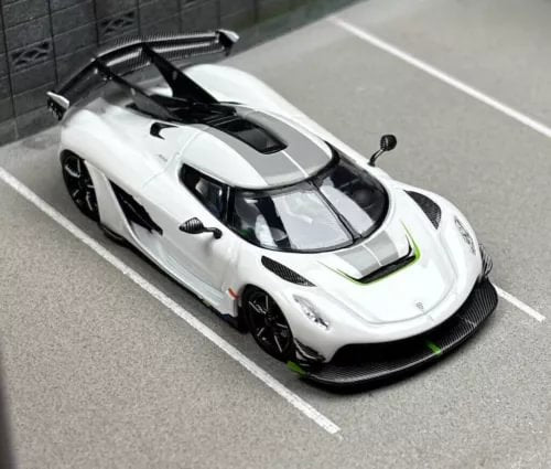 White diecast sport racing car model with black aero details, front 3/4 view