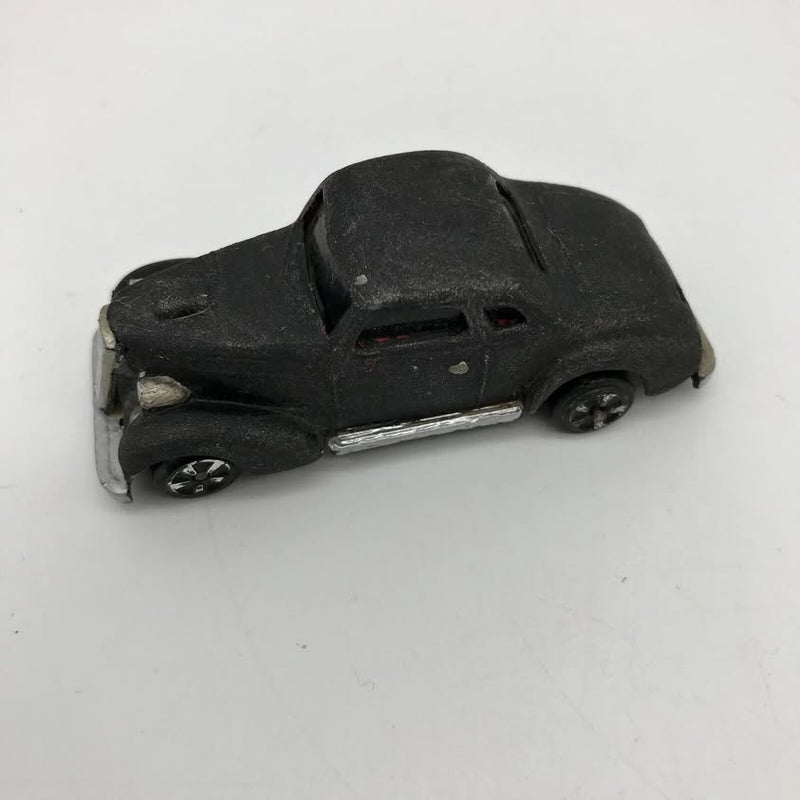 Dark gray diecast toy coupe car with black wheels