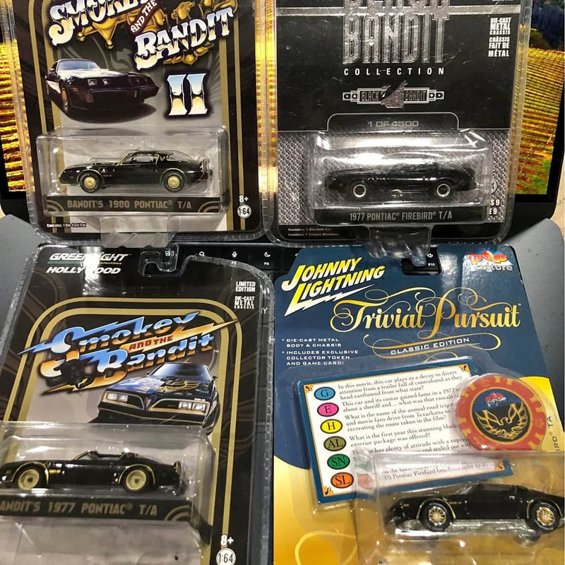 Green diecast Trans Am model car in retail blister pack, Greenlight and Johnny Lightning.