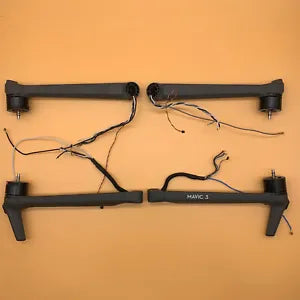 Metal drone arm assembly with front and rear arms, motor mounts, and attached cables