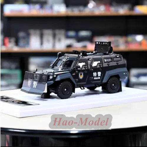Police armored diecast toy car with black and gray body, side doors and wheels