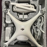 Gray foldable DJI drone body with four arms and front gimbal mount