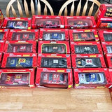 Red NASCAR diecast car lot in retail boxes, multiple cars