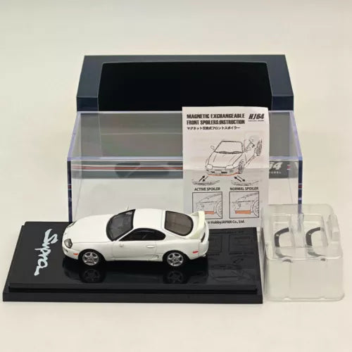 1:64 white diecast Toyota Supra model with active rear spoiler parts, in display box