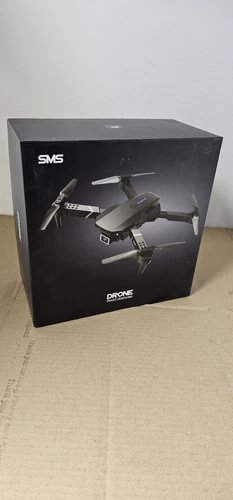 Foldable 4K camera drone product box, shows gray quadcopter and propellers